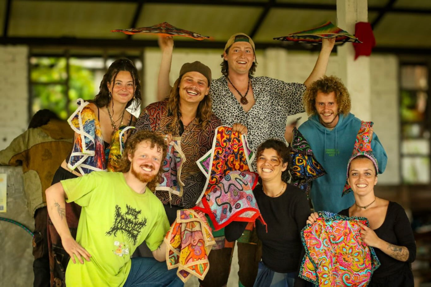 The crew smiling, holding up handmade Dapo spinning stars